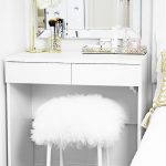 DIY fuzzy stool pictured underneath a white dressing table in girl's bedroom
