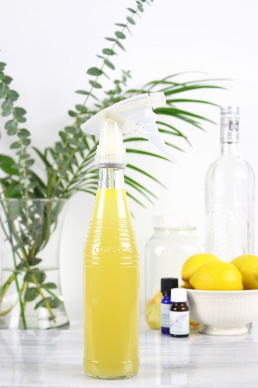 Bottle of DIY cleaning spray with vodka and essential oils