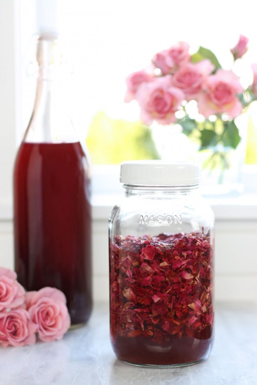 Jar full of rose petals infusing the rose petal vinegar