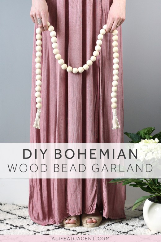 Woman holding DIY bohemian wood bead garland