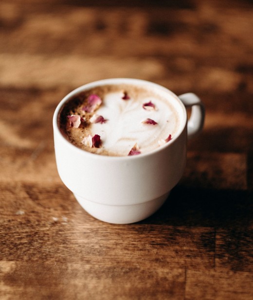 Homemade latte garnished with rose petals