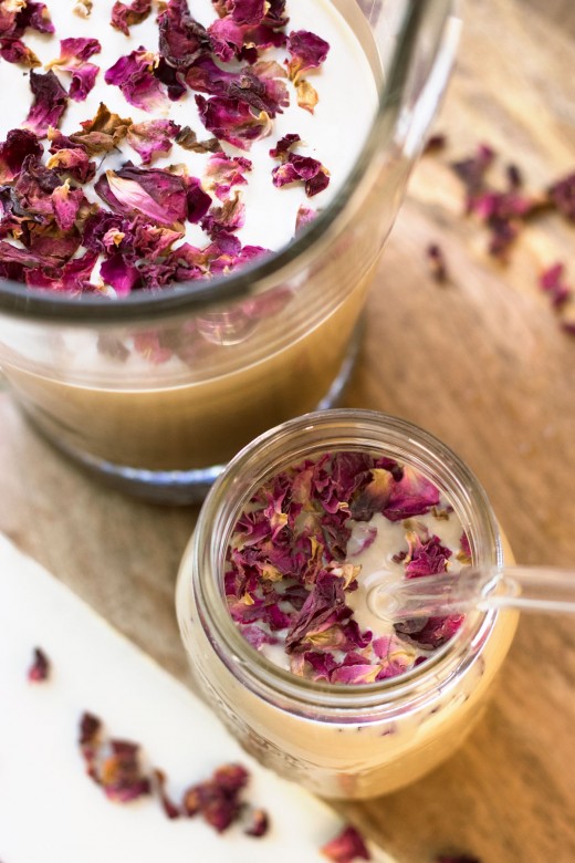 Homemade iced latte garnished with rose petals