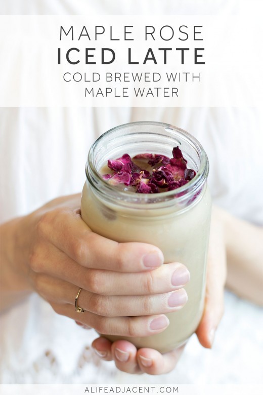 Homemade iced latte cold brewed with maple water and garnished with rose petals
