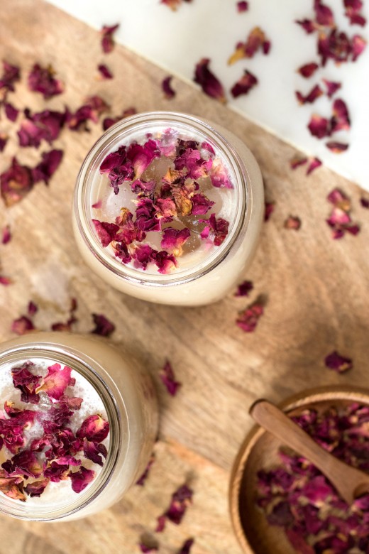 Maple iced latte with edible rose petals as garnish
