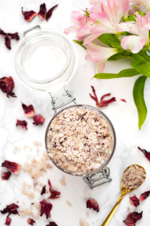 Homemade sugar scrub with hibiscus petals