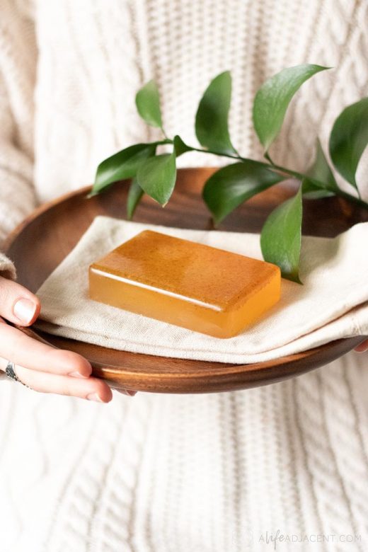 DIY honey almond soap on wood plate