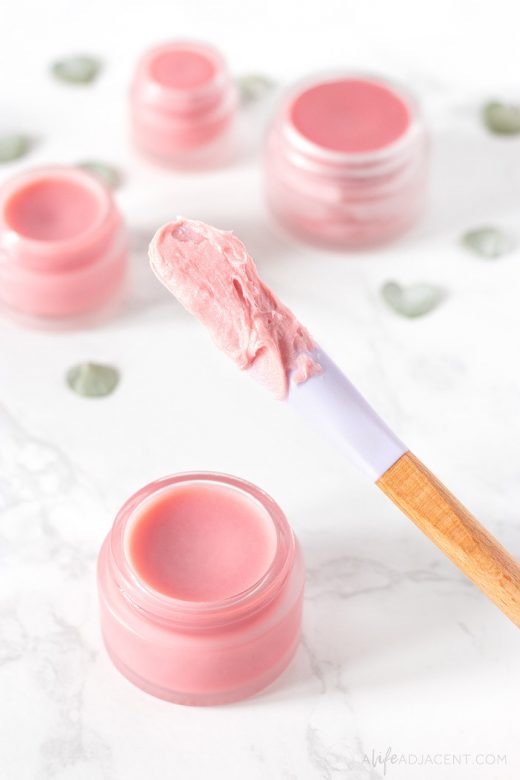 Homemade tinted lip balm on spatula