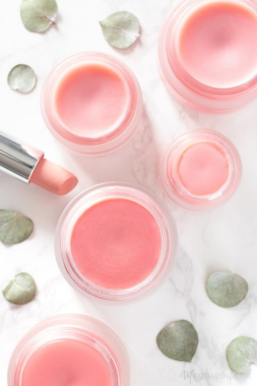 Homemade tinted lip balm with pink lipstick