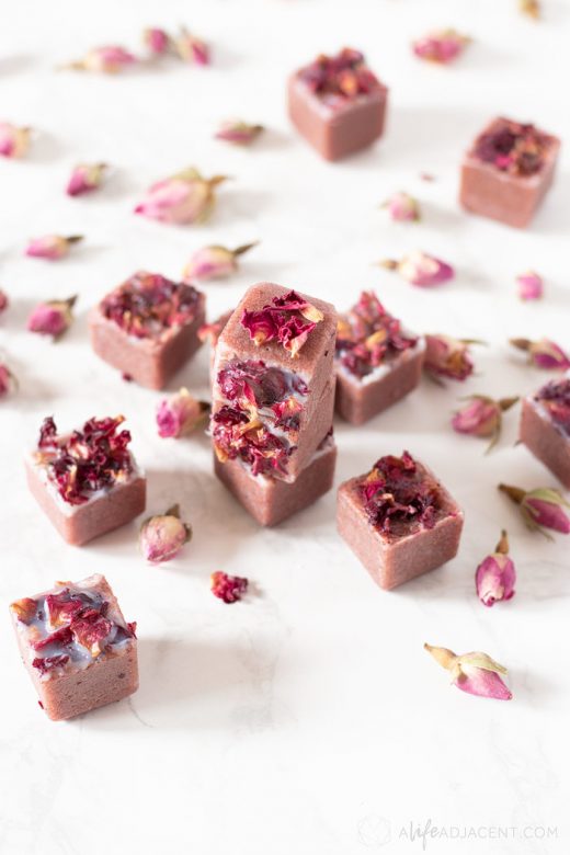 Pile of sugar scrub cubes with rose buds