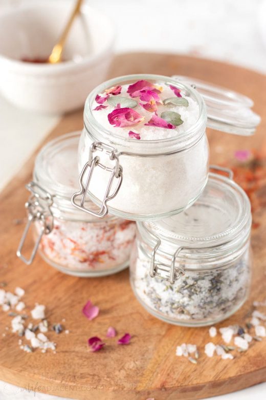 Homemade bath salts stacked in glass jars