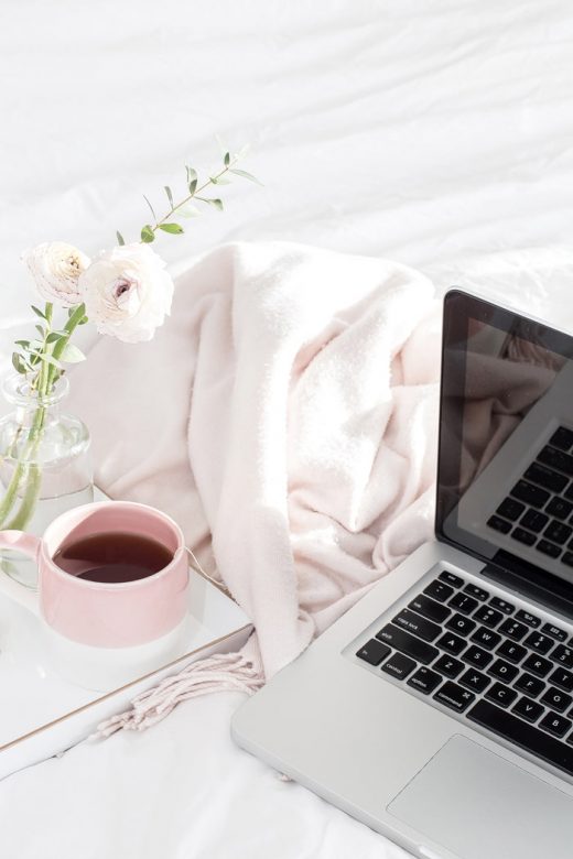 Laptop computer with coffee cup