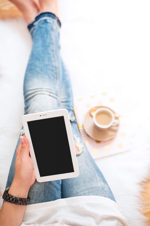 Woman using tablet working from home