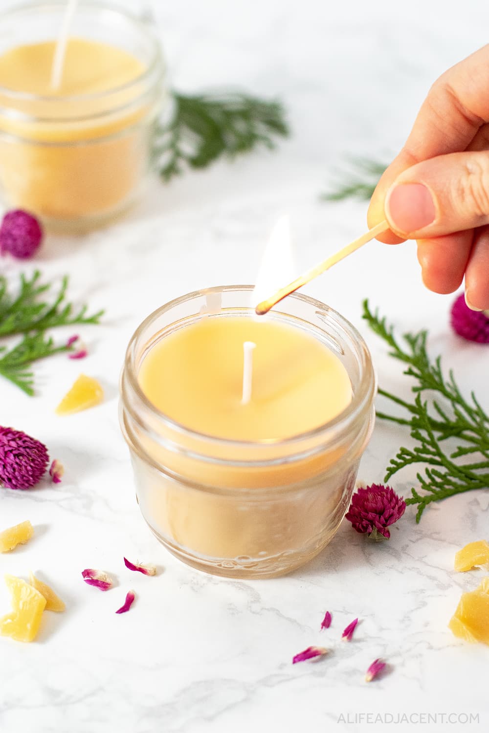 Lighting homemade fall scented candle