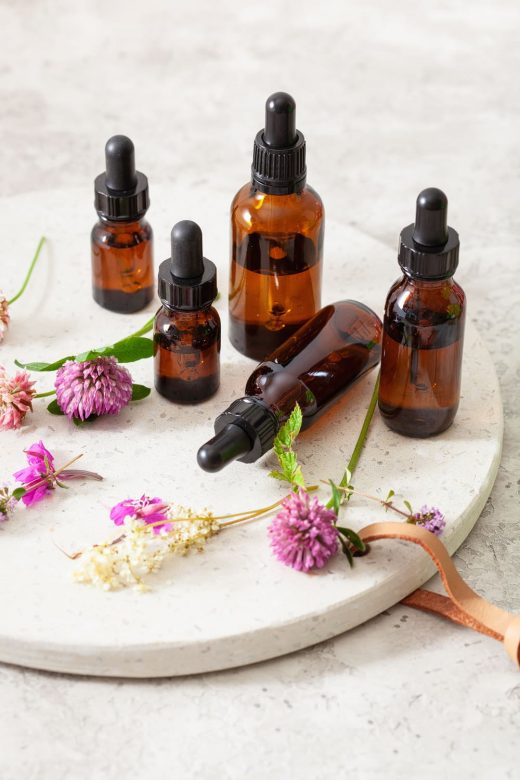 Bottles of various essential oils that can help eliminate body odor.