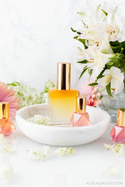 DIY essential oil perfume spray with flowers.