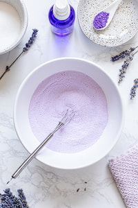 DIY lavender shower steamers recipe ingredients in bowl.