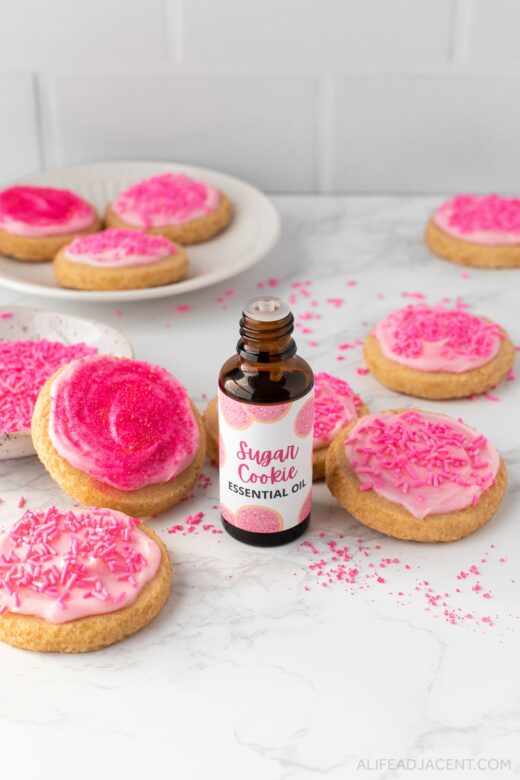 Cookie essential oil with pink sprinkle sugar cookies.