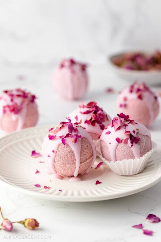 Romantic bath bombs with rose petals and essential oils