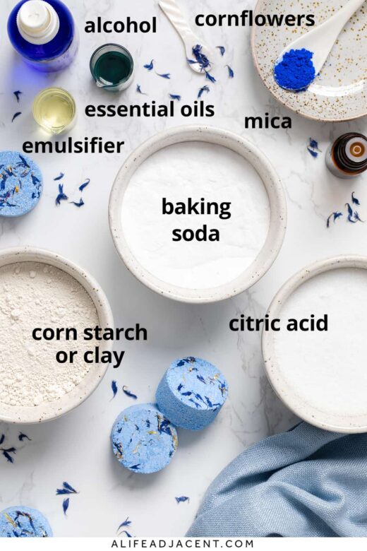 Allergy shower bombs recipe ingredients: baking soda, citric acid, corn starch or clay, essential oils, emulsifier, and cornflowers.