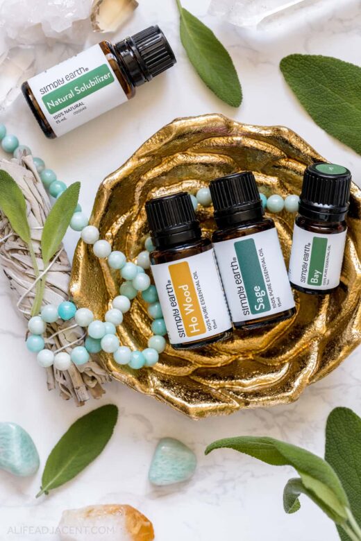 Spiritual essential oils for aura cleansing spray – sage, ho wood, and bay laurel leaf.
