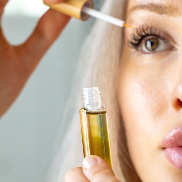 DIY eyelash serum for growth &ndash; woman applying serum to lashes