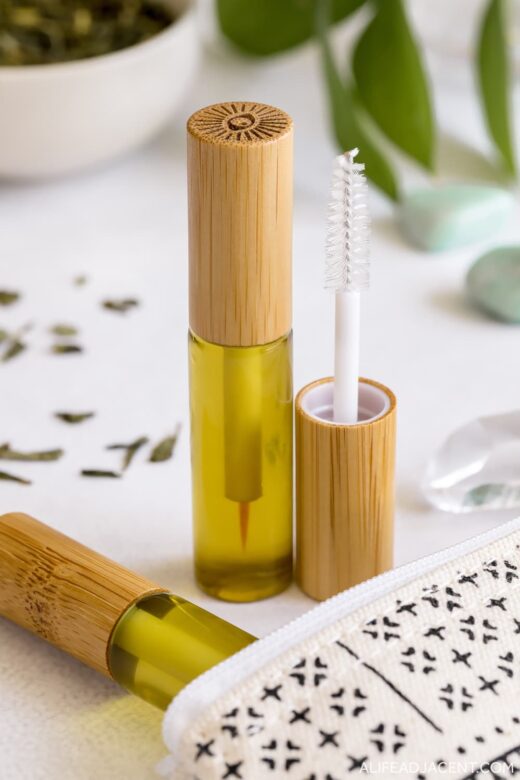 Homemade eyelash serum packaging: glass eyeliner bottle and mascara bottle for brow serum