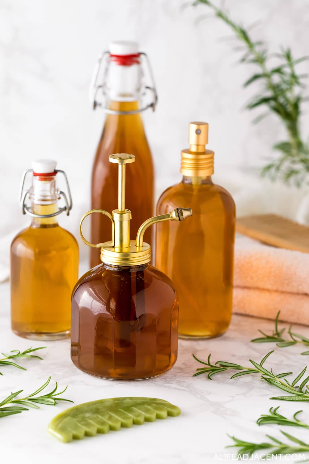 Bottles of rosemary tea for hair growth