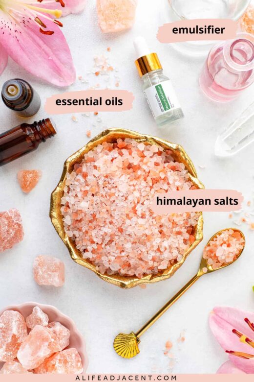 Ingredients for Himalayan salt bath recipe: pink Himayalan salt crystals, caprylyl/capryl glucoside, and essential oils for aromatherapy benefits