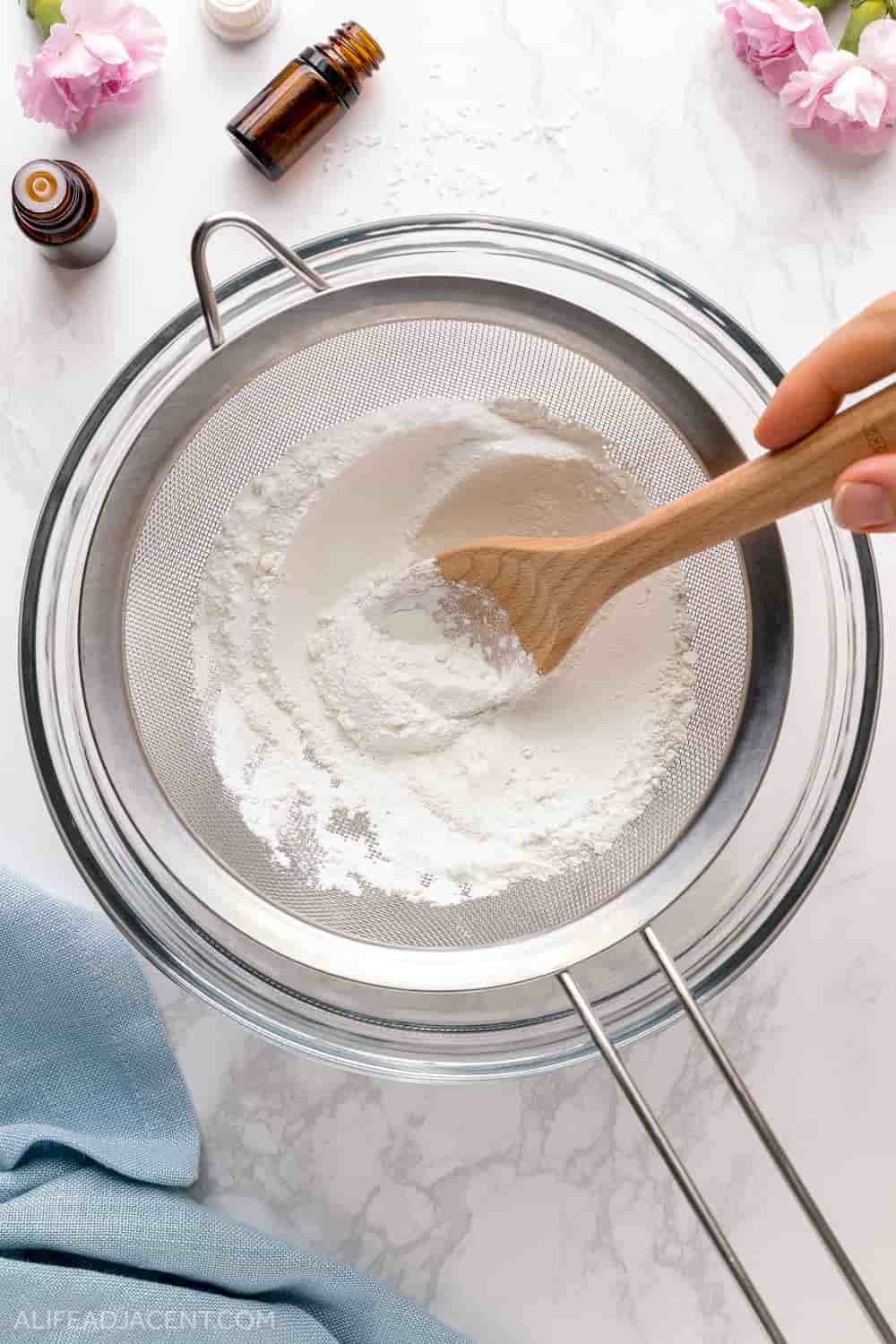 Sifting dry ingredients in mixing bowl