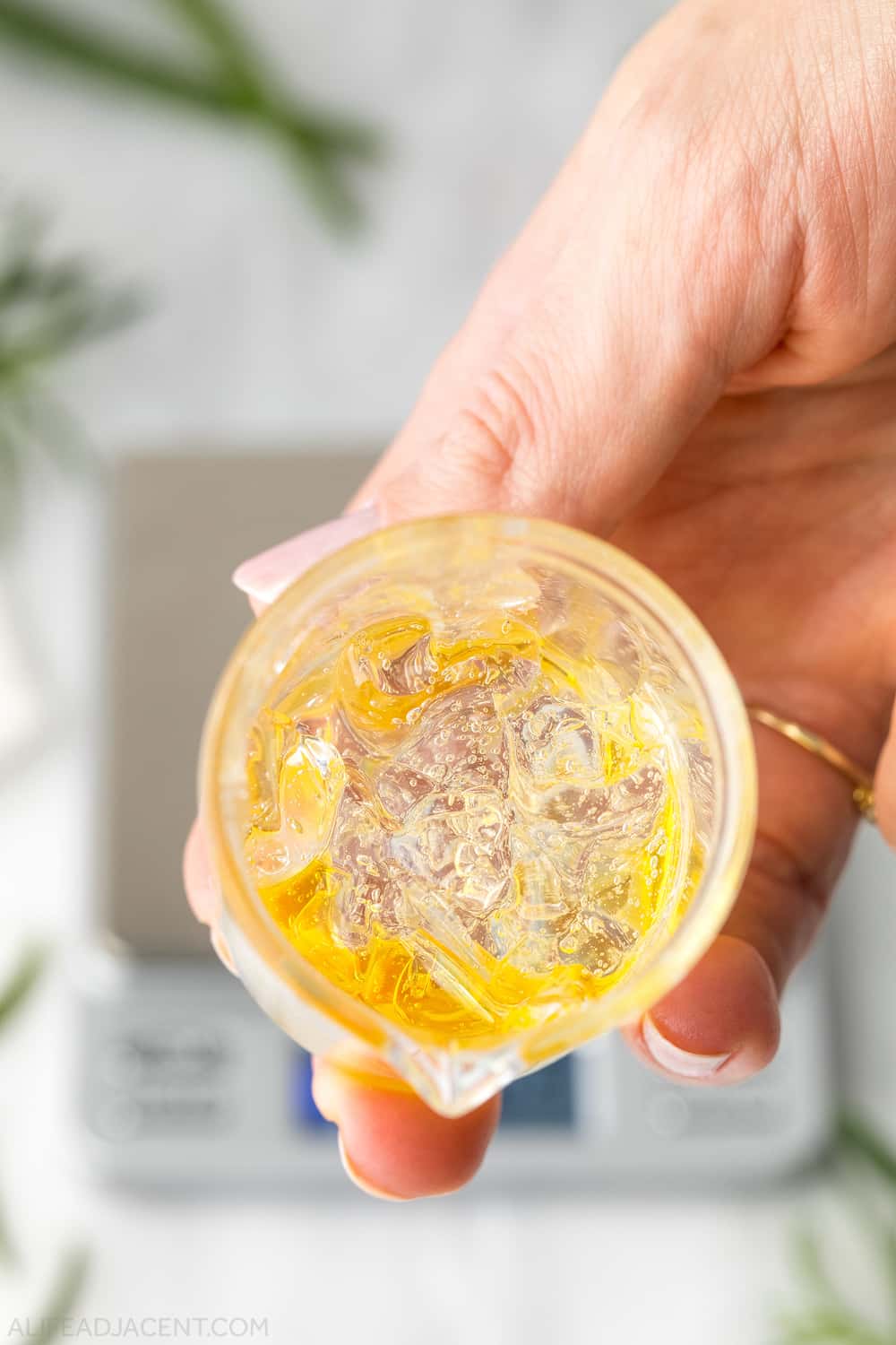 Aloe and rosemary serum in glass beaker before emulsifying.