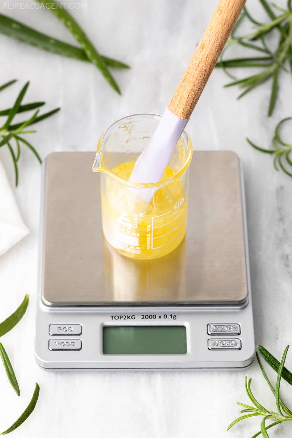 Mixing hair serum with silicone spatula.