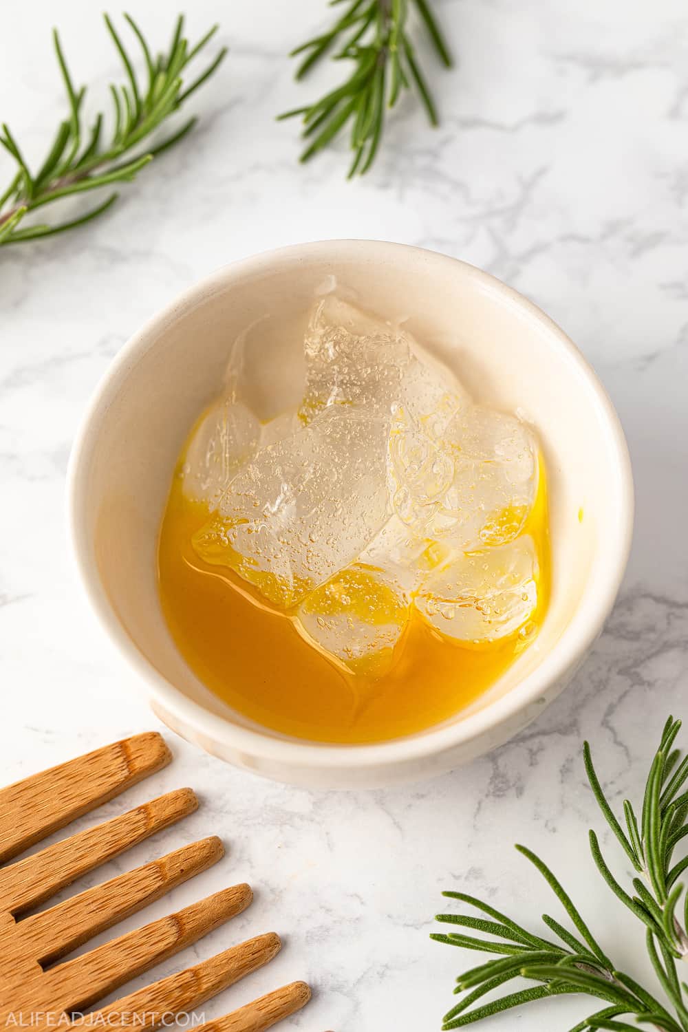 Hair mask with rosemary oil, aloe and lecithin in bowl before mixing.