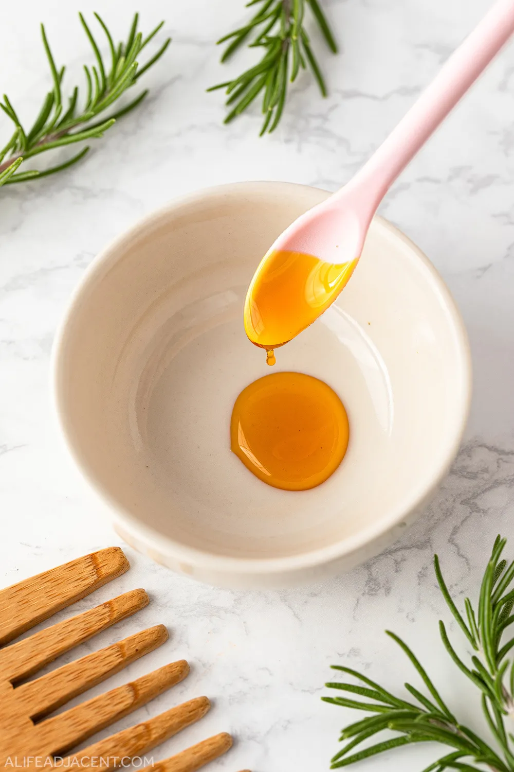 Pouring liquid sunflower lecithin into small bowl.