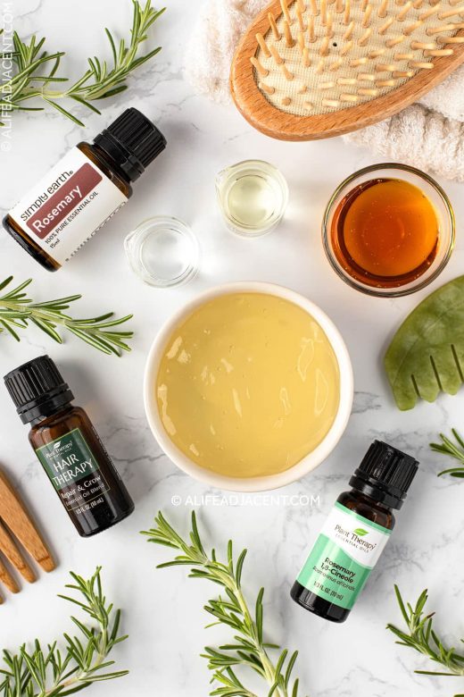 Rosemary essential oil bottles with hair growth ingredients.