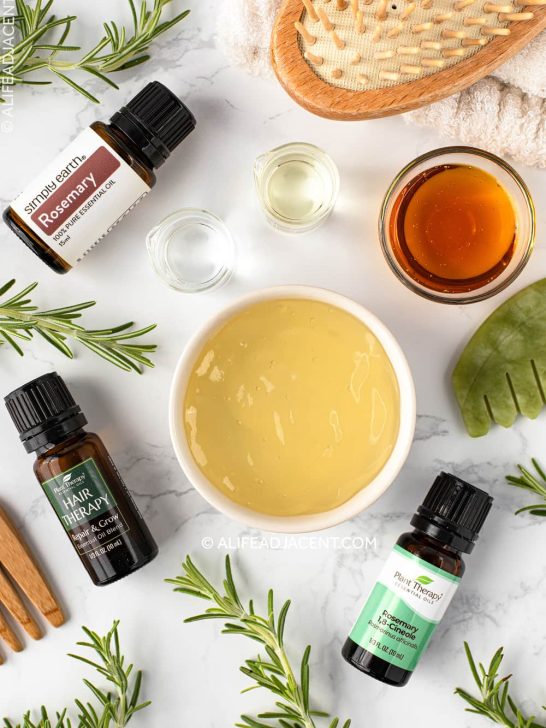 Rosemary essential oil bottles with hair growth ingredients.