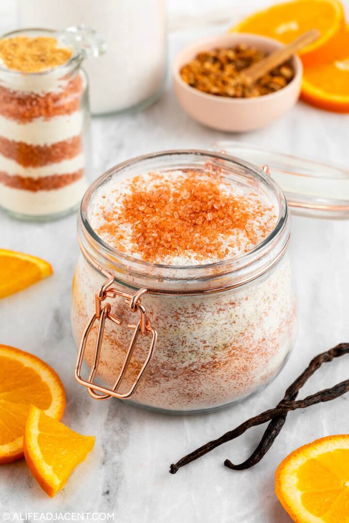 DIY orange vanilla bath recipe with creamsicle essential oil blend, Epsom salts, and orange slices
