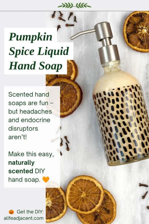 Decorative glass bottle filled with homemade pumpkin spice liquid hand soap, surrounded by dried oranges, cinnamon and cloves. Text reads &ldquo;Pumpkin Spice Liquid Hand Soap&rdquo; and describes an easy, naturally scented DIY hand soap made with essential oils.