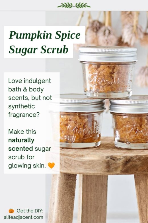 Three small glass jars of pumpkin spice sugar scrub displayed on a wooden stool. Text reads &ldquo;Pumpkin Spice Sugar Scrub&rdquo; and describes a naturally scented sugar scrub for glowing skin.